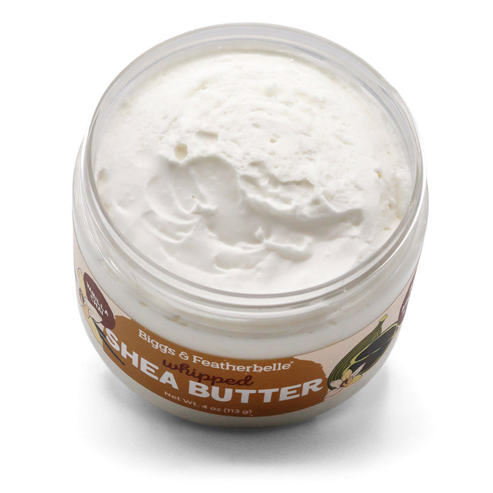 Tilted, opened jar of Biggs & Featherbelle Vanilla Chai whipped shea butter on a white background