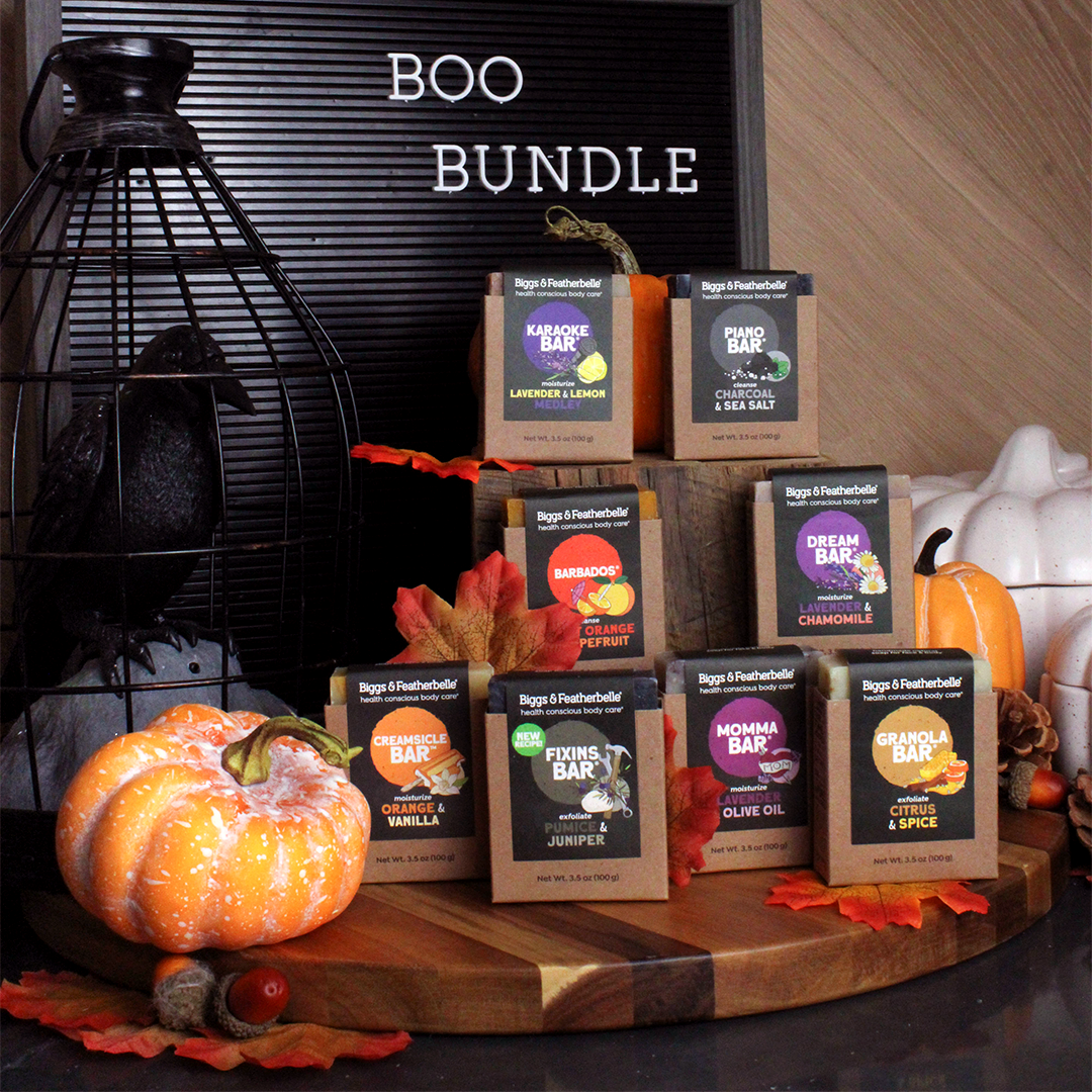 Collection of B&F soap bars on a wooden board with pumpkins and a 'BOO BUNDLE' sign in the background.