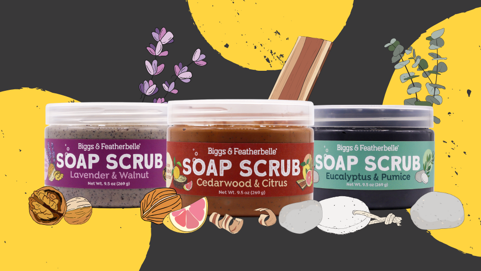 Three jars of Biggs & Featherbelle soap scrubs with labels on a black background with yellow circles.