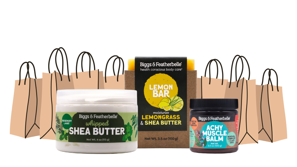 Collection of Biggs & Featherbelle products including shea butter, lemon bar, and achy muscle balm with packaging on a white background.