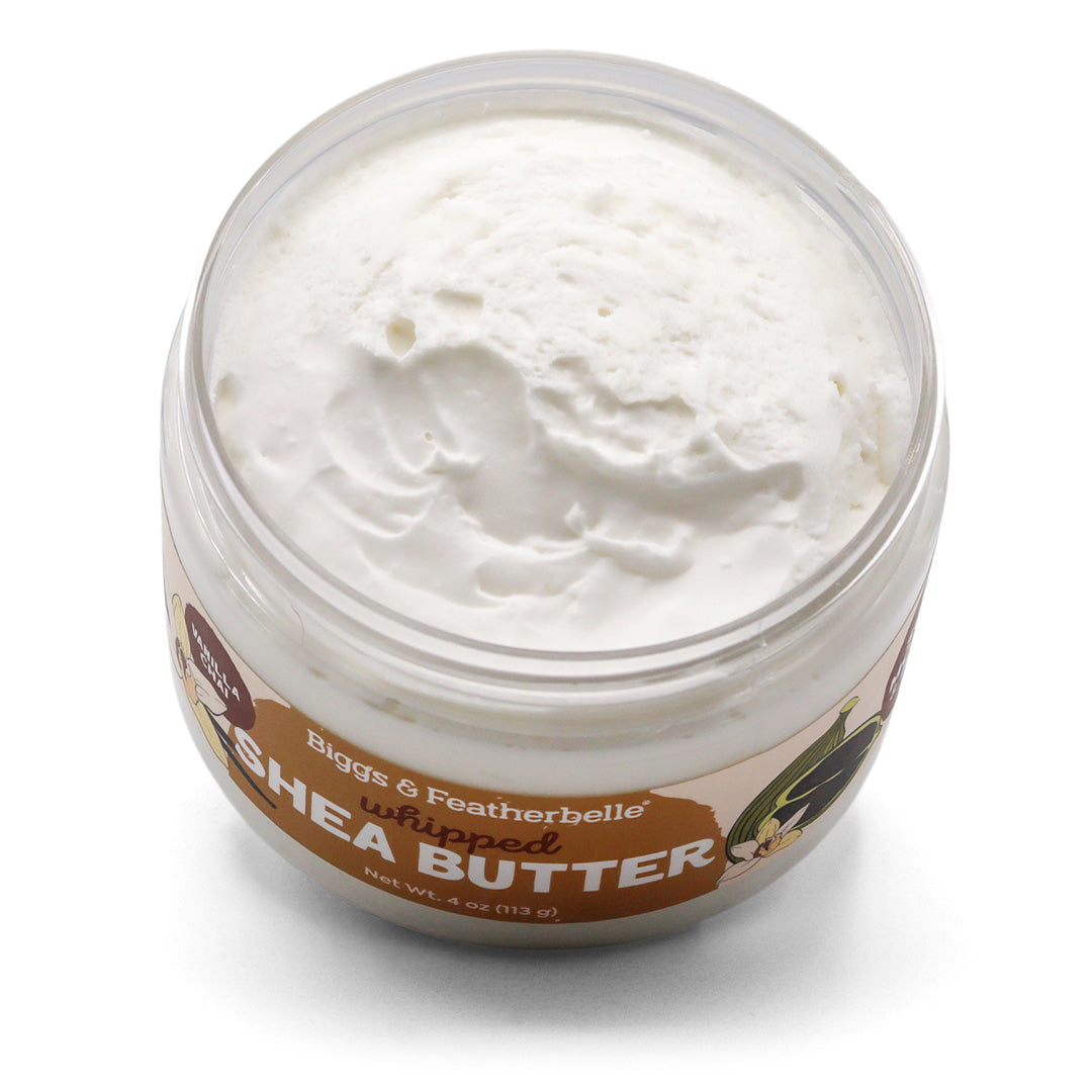 Tilted, opened jar of Biggs & Featherbelle Vanilla Chai whipped shea butter on a white background