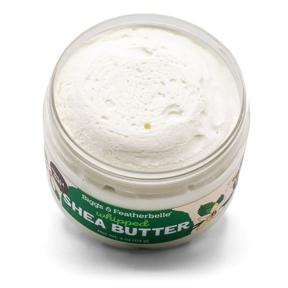 Tilted, open jar of Biggs & Featherbelle Vanilla Mint whipped shea butter on a white background