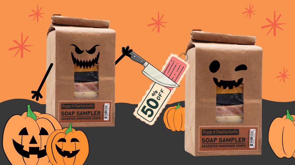Two brown paper soap sampler bags with cartoon jack-o'-lantern faces are shown on an orange and dark gray Halloween-themed background. One bag is being sliced open with a knife, and a sale tag reading 50% OFF is attached.