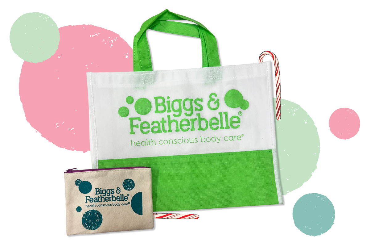 Green tote bag and pouch with 'Biggs & Featherbelle' branding on a white background with colorful circles.